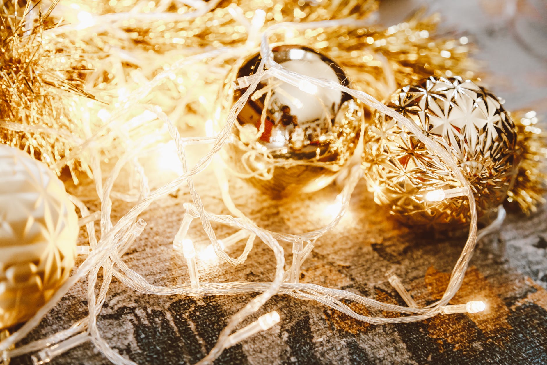 string lights over gold bauble and garland